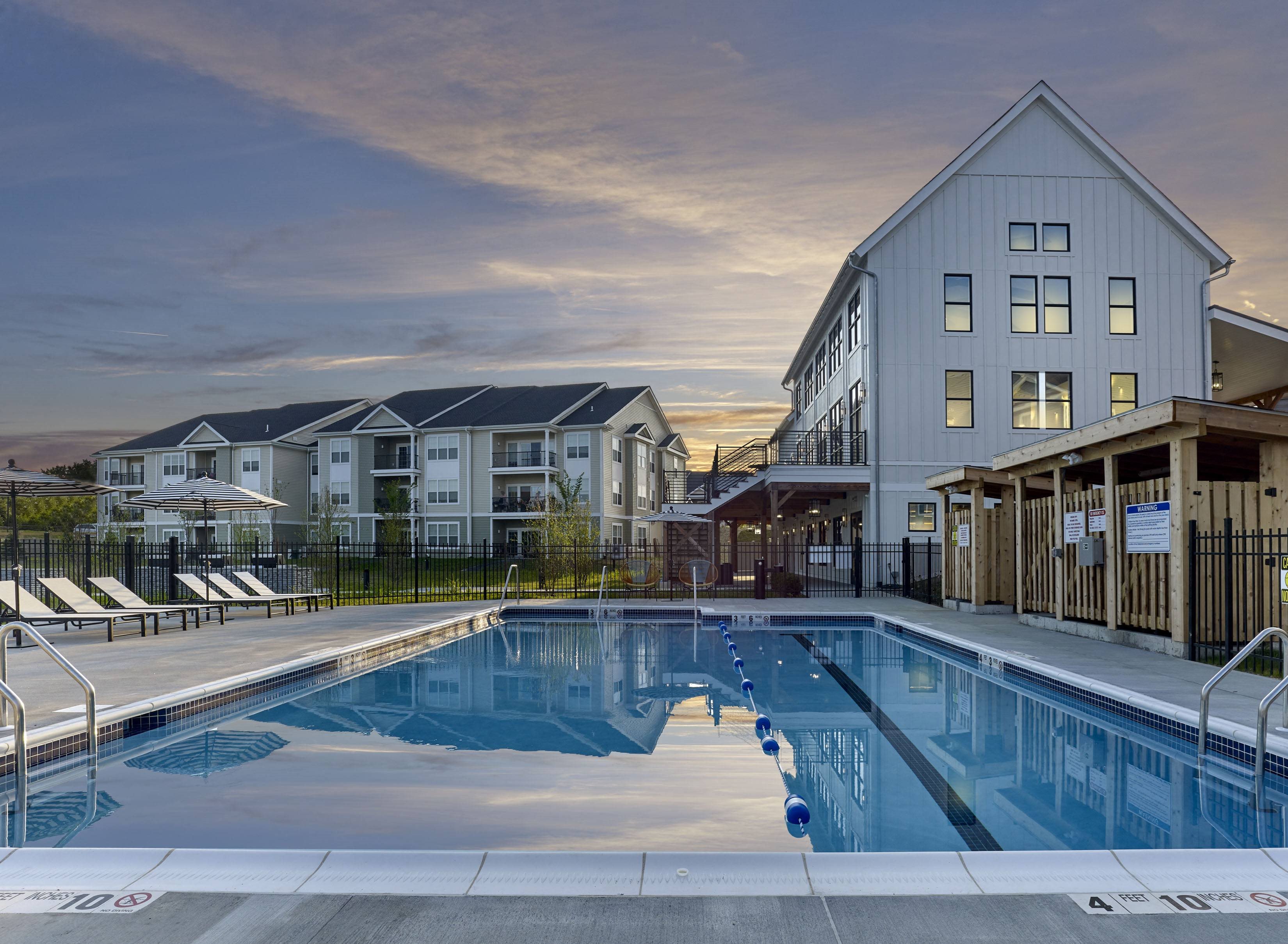 a swimming pool in front of a building